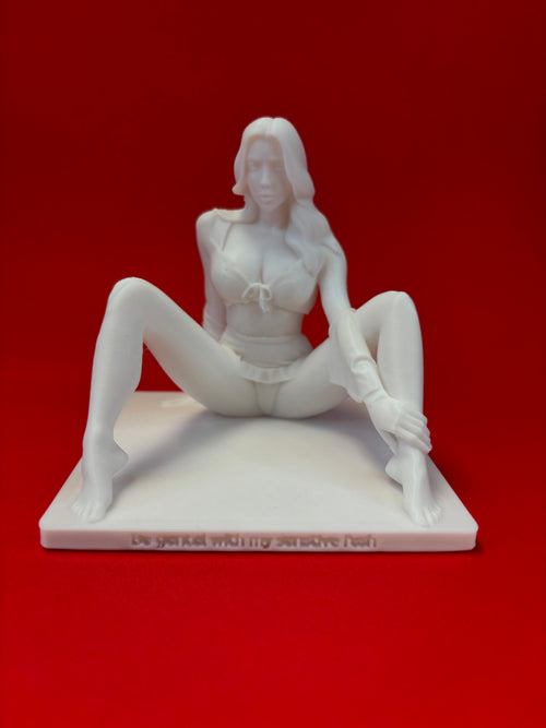 White sculpture of a person on a red background