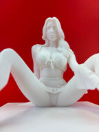 White figurine of a woman on a red background