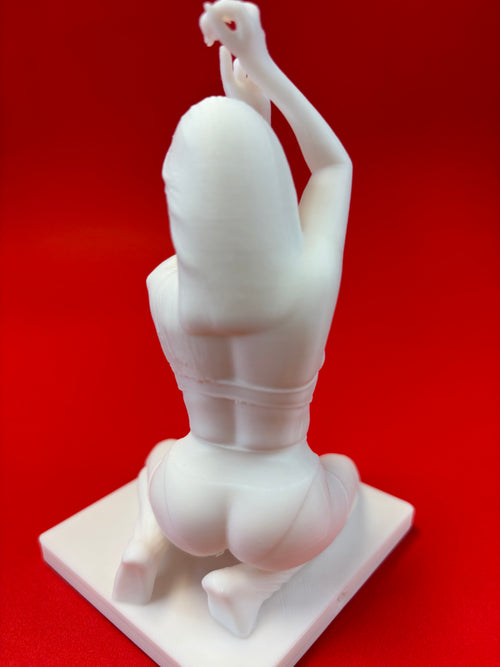 White sculpture of a person in a dynamic pose on a red background
