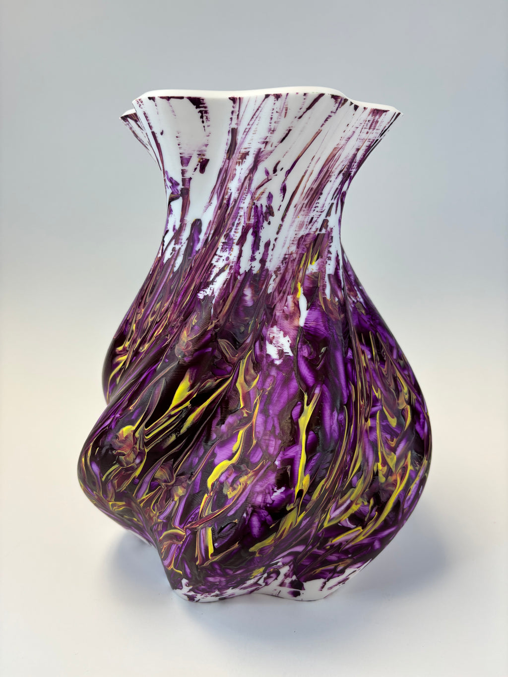 Decorative vase piece with purple and gold swirls