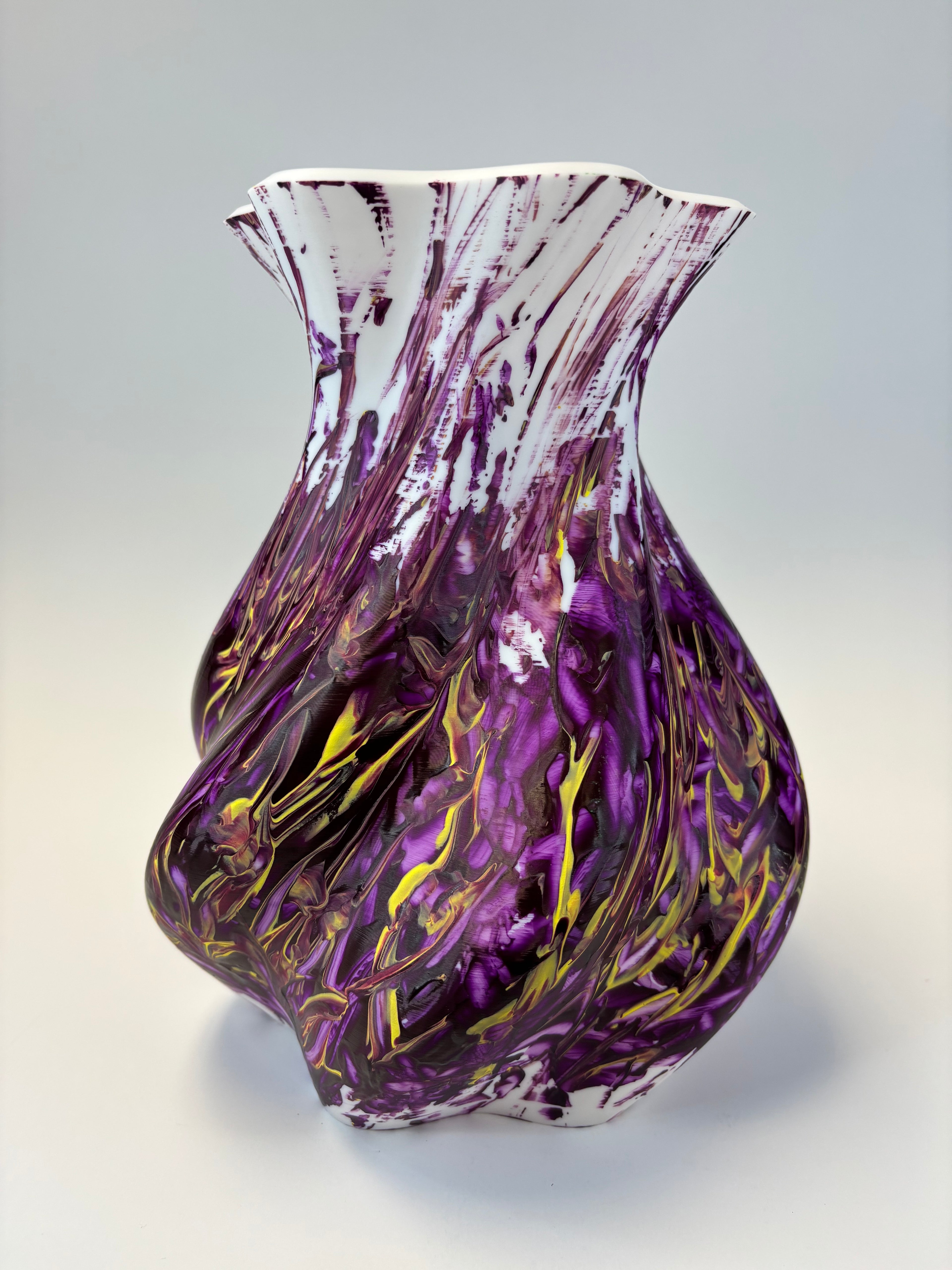 Decorative vase piece with purple and gold swirls