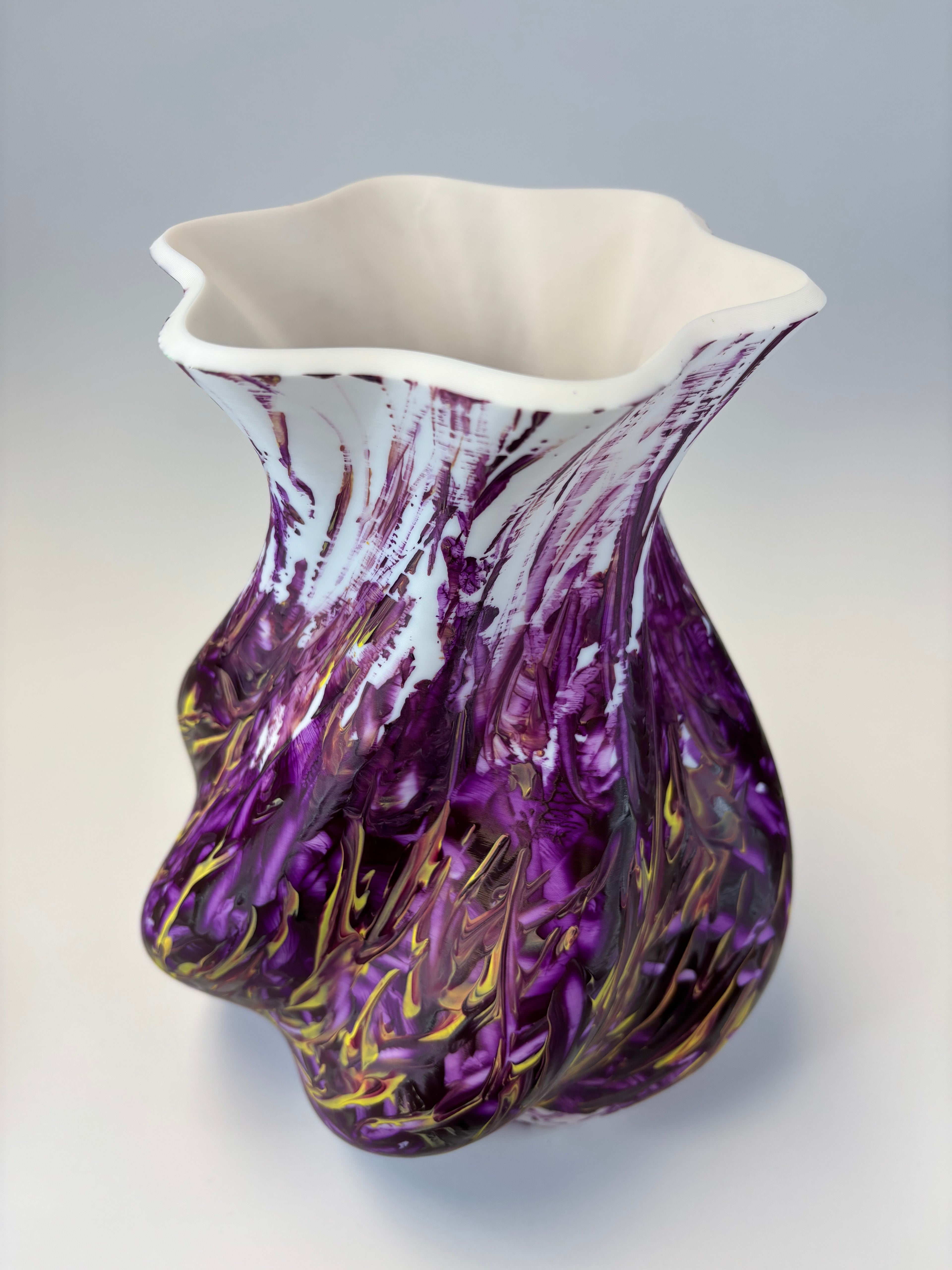 Decorative vase piece with purple and gold swirls