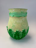 Green ceramic vase with textured surface