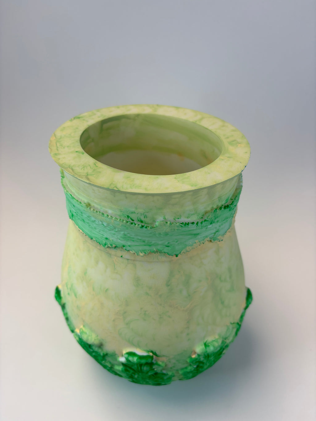 Green ceramic vase with textured surface