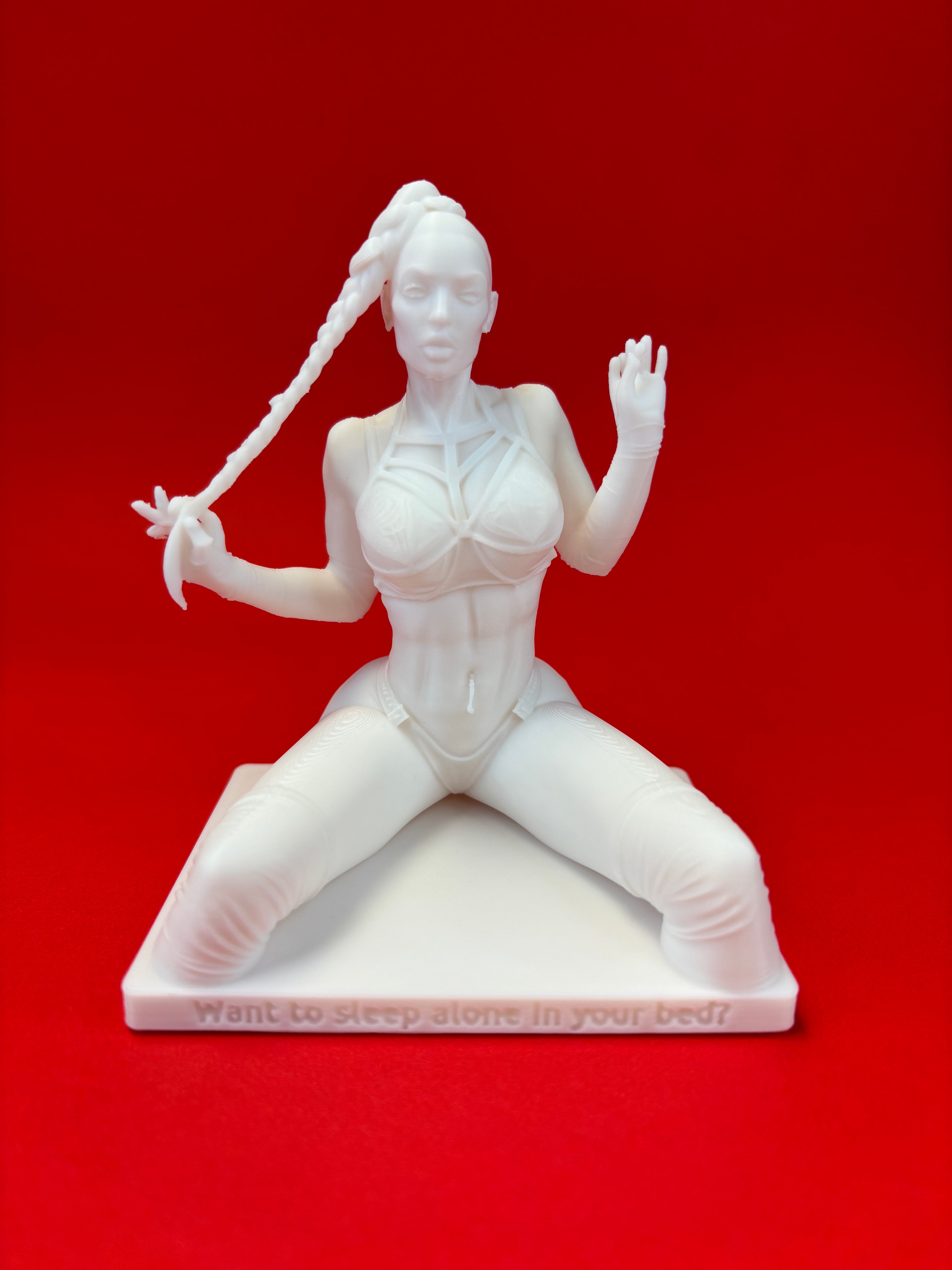 White figurine on a red background