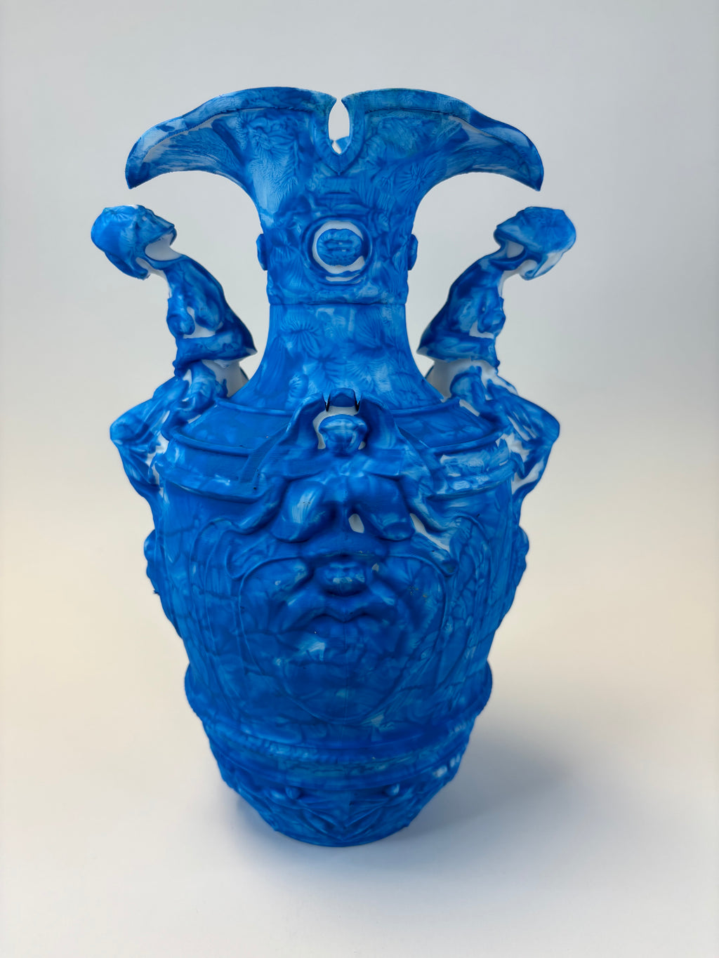 Blue vase with decorative elements