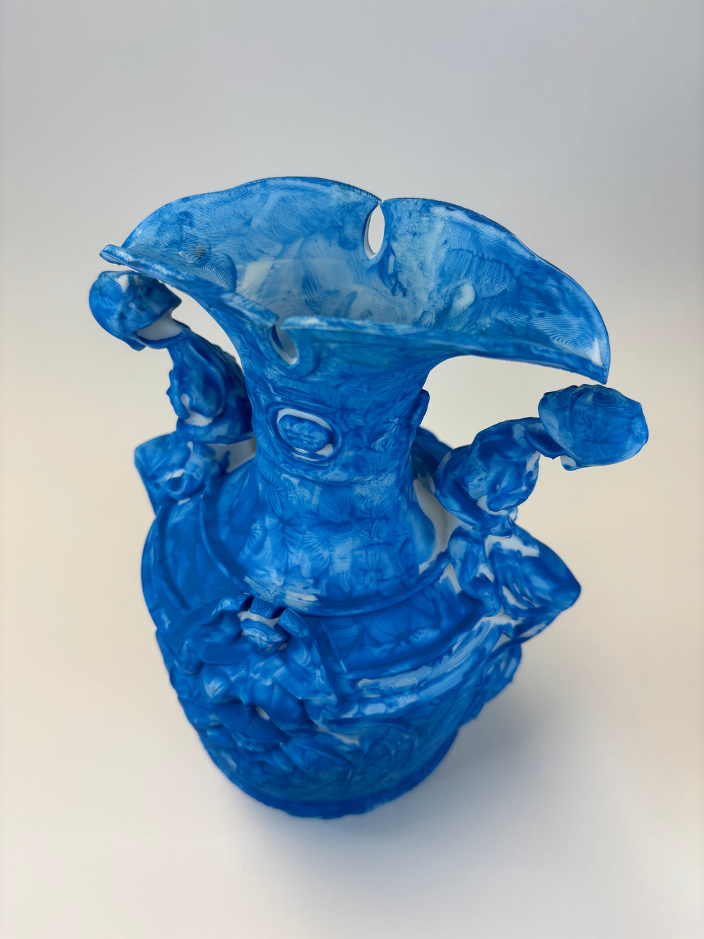 Blue vase with decorative elements