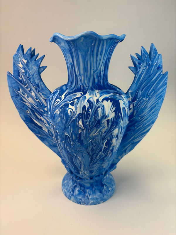 Blue vase sculpture on a beige background