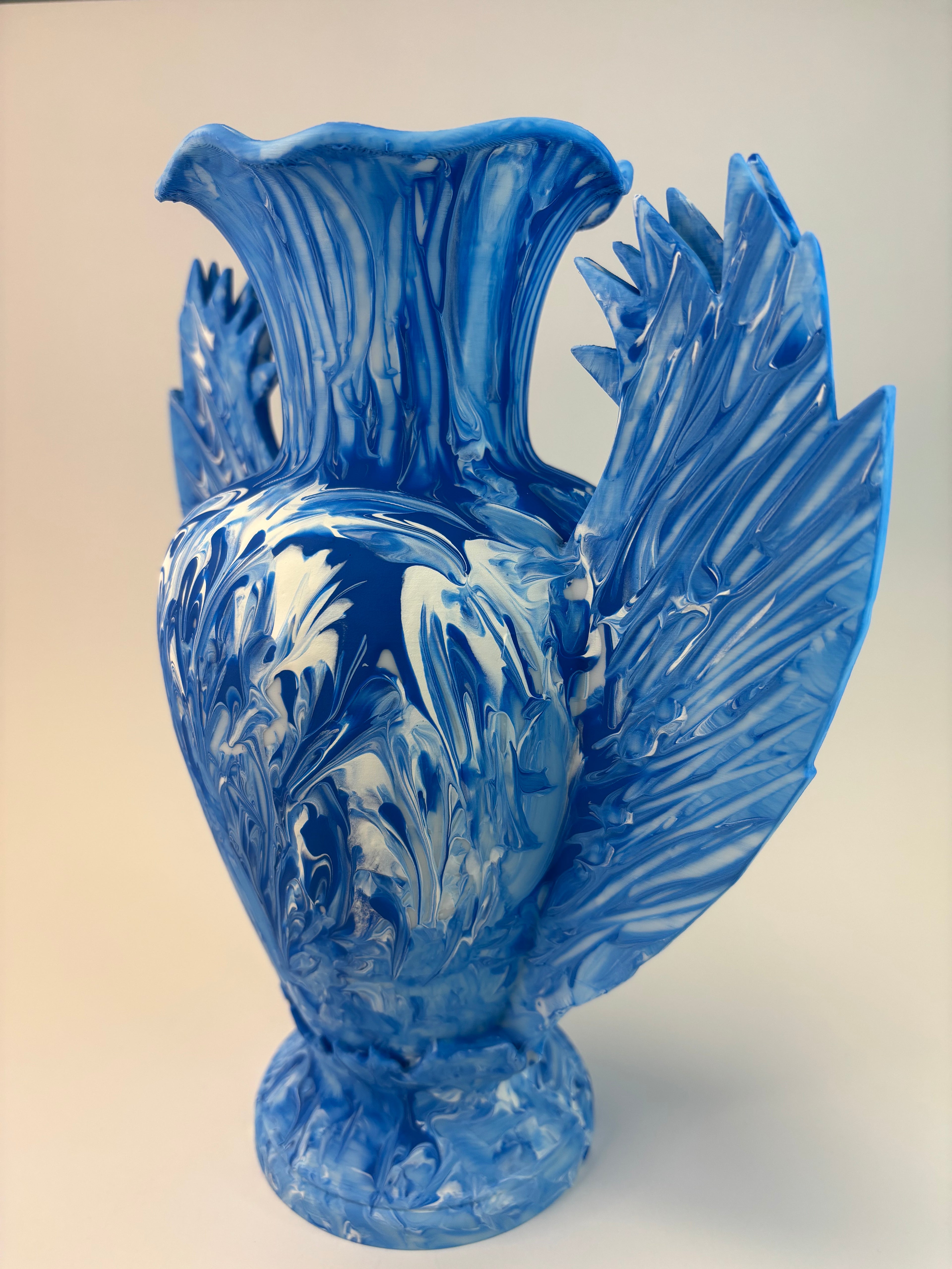 Blue vase with intricate patterns on a beige background