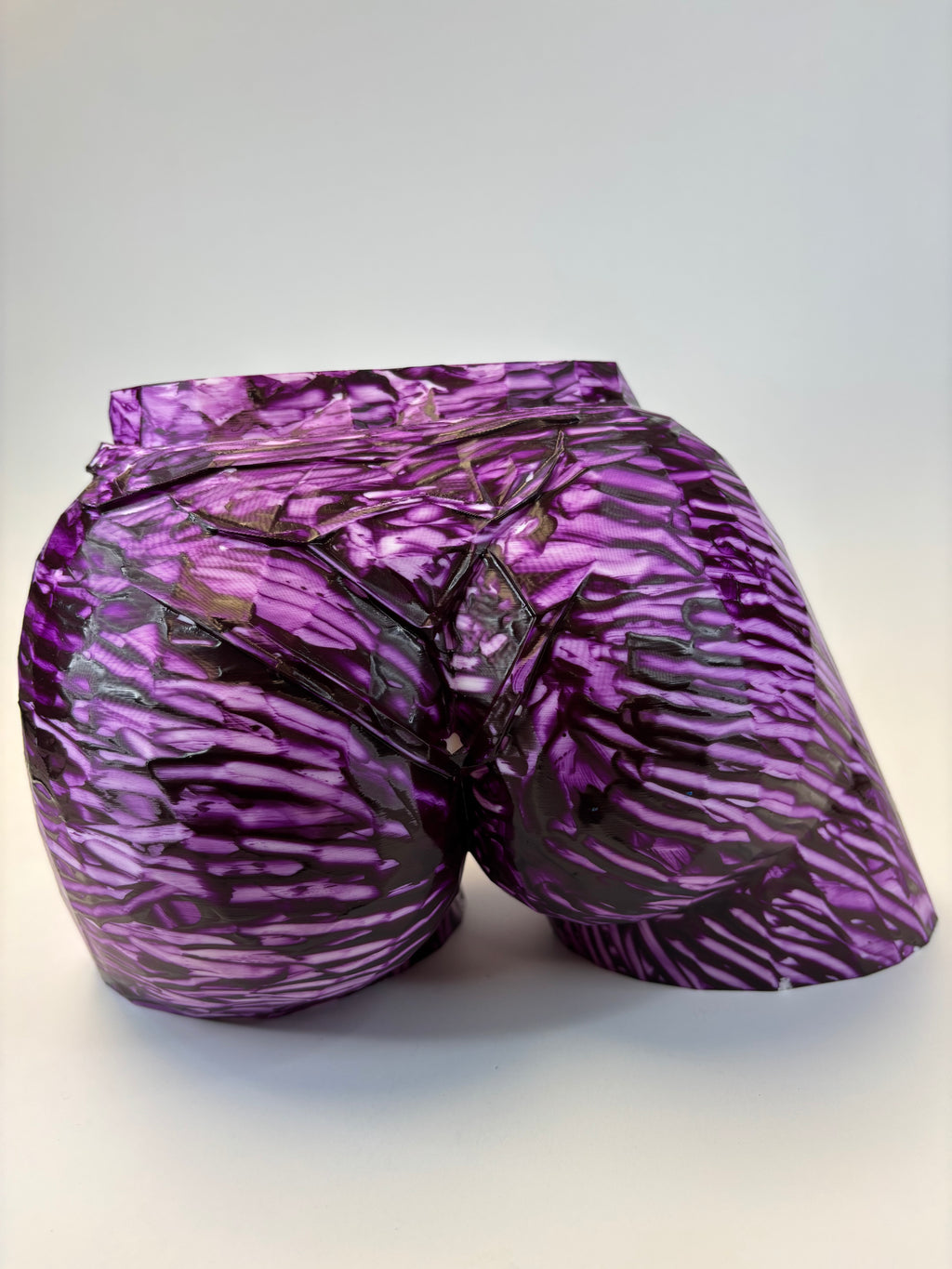 Purple and black patterned ass like vase.