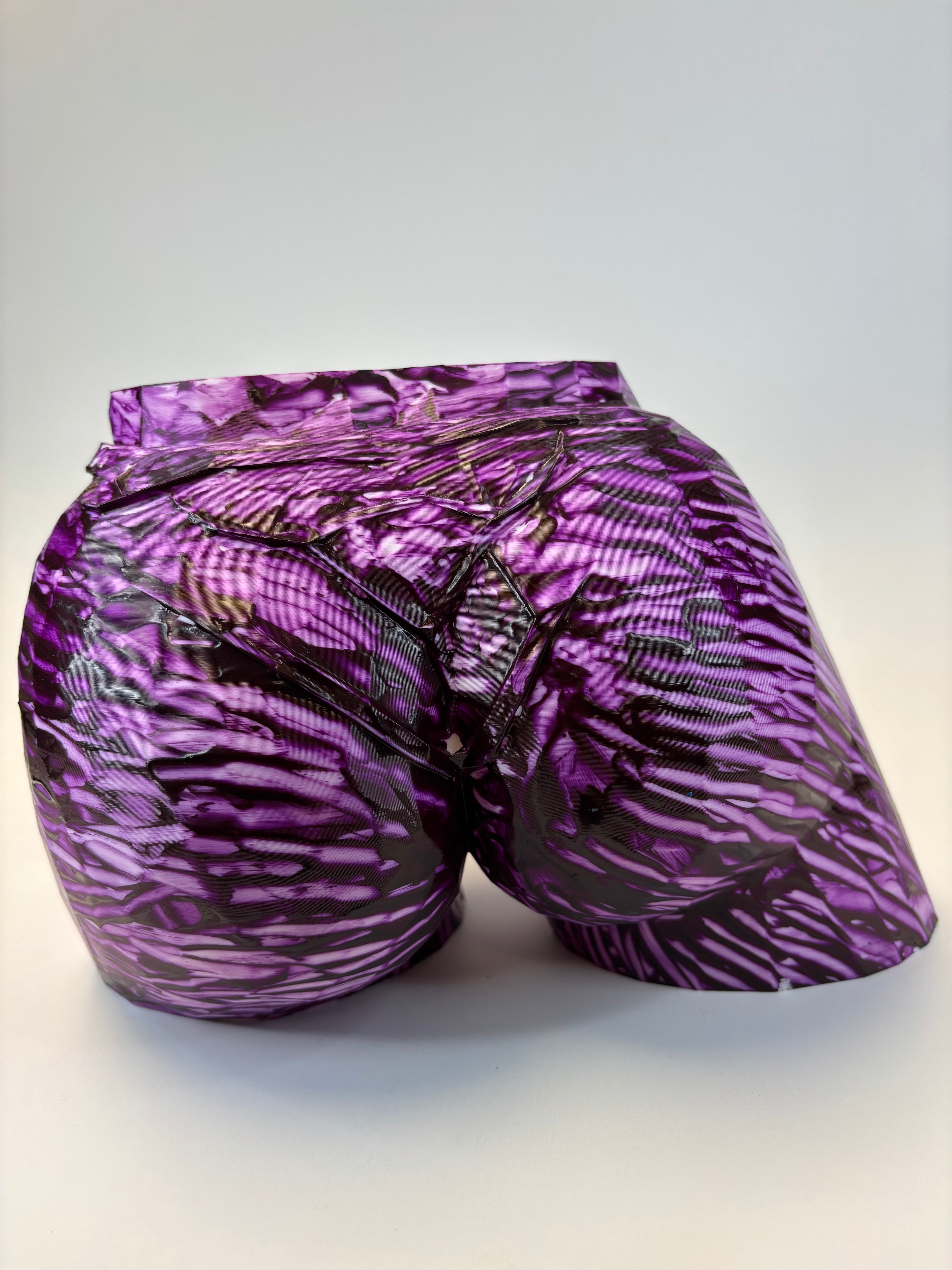 Purple and black patterned ass like vase.