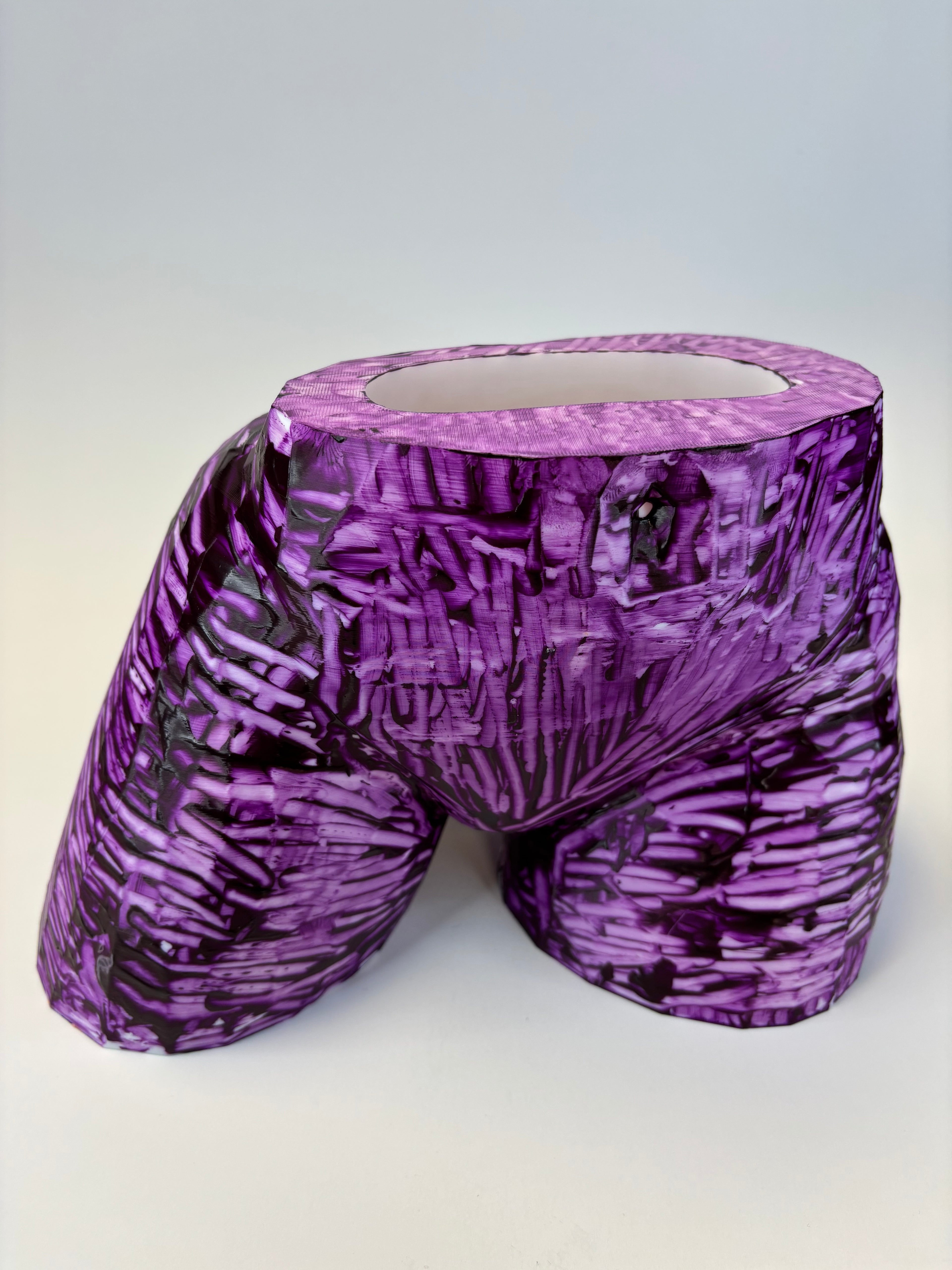 Purple and black patterned ass like vase.