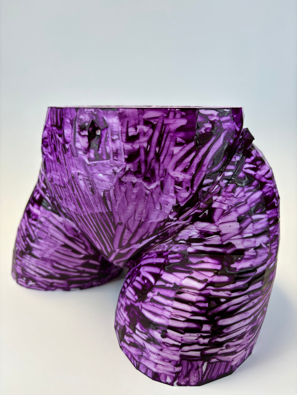 Purple and black patterned ass like vase.