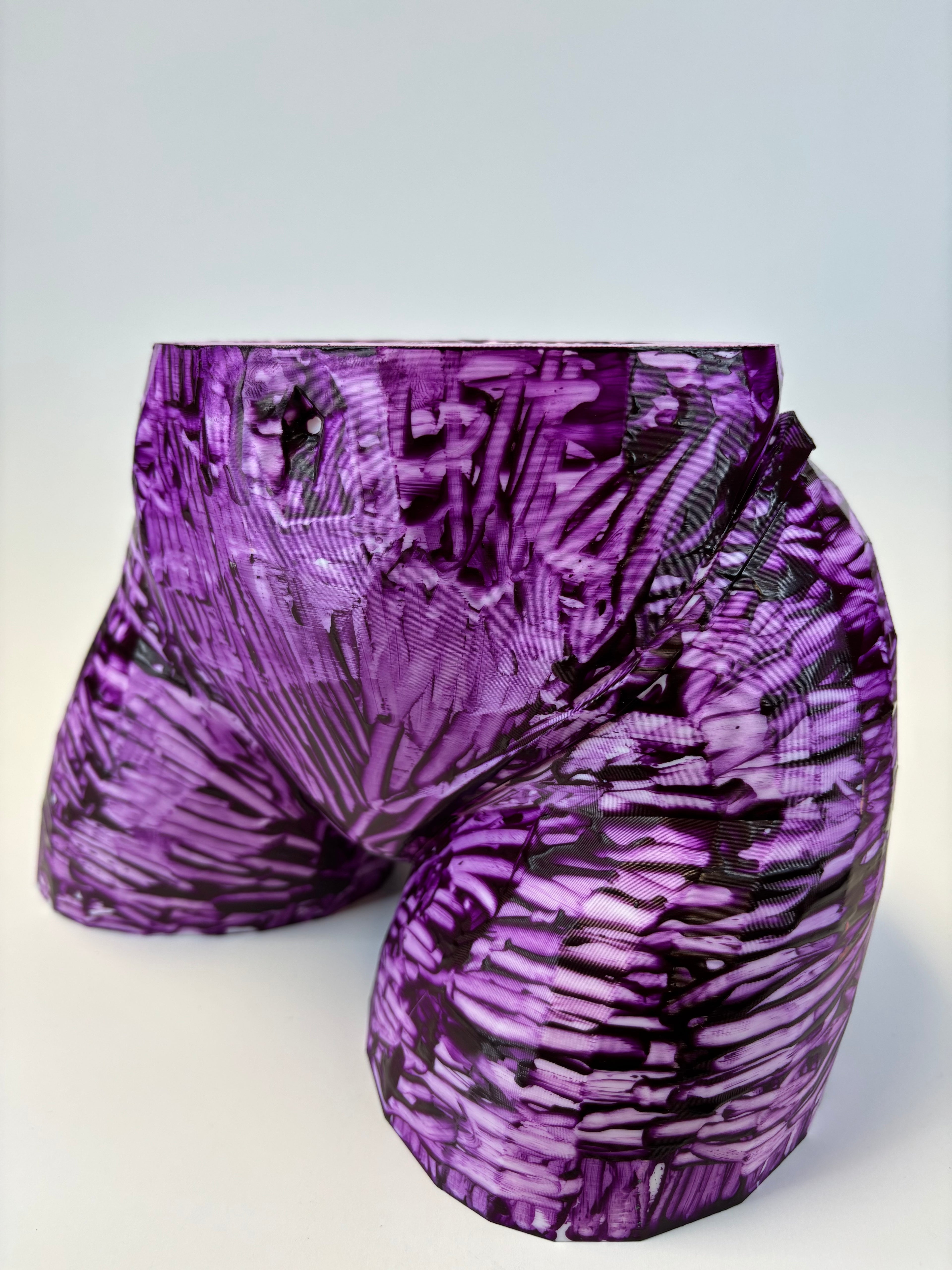 Purple and black patterned ass like vase.