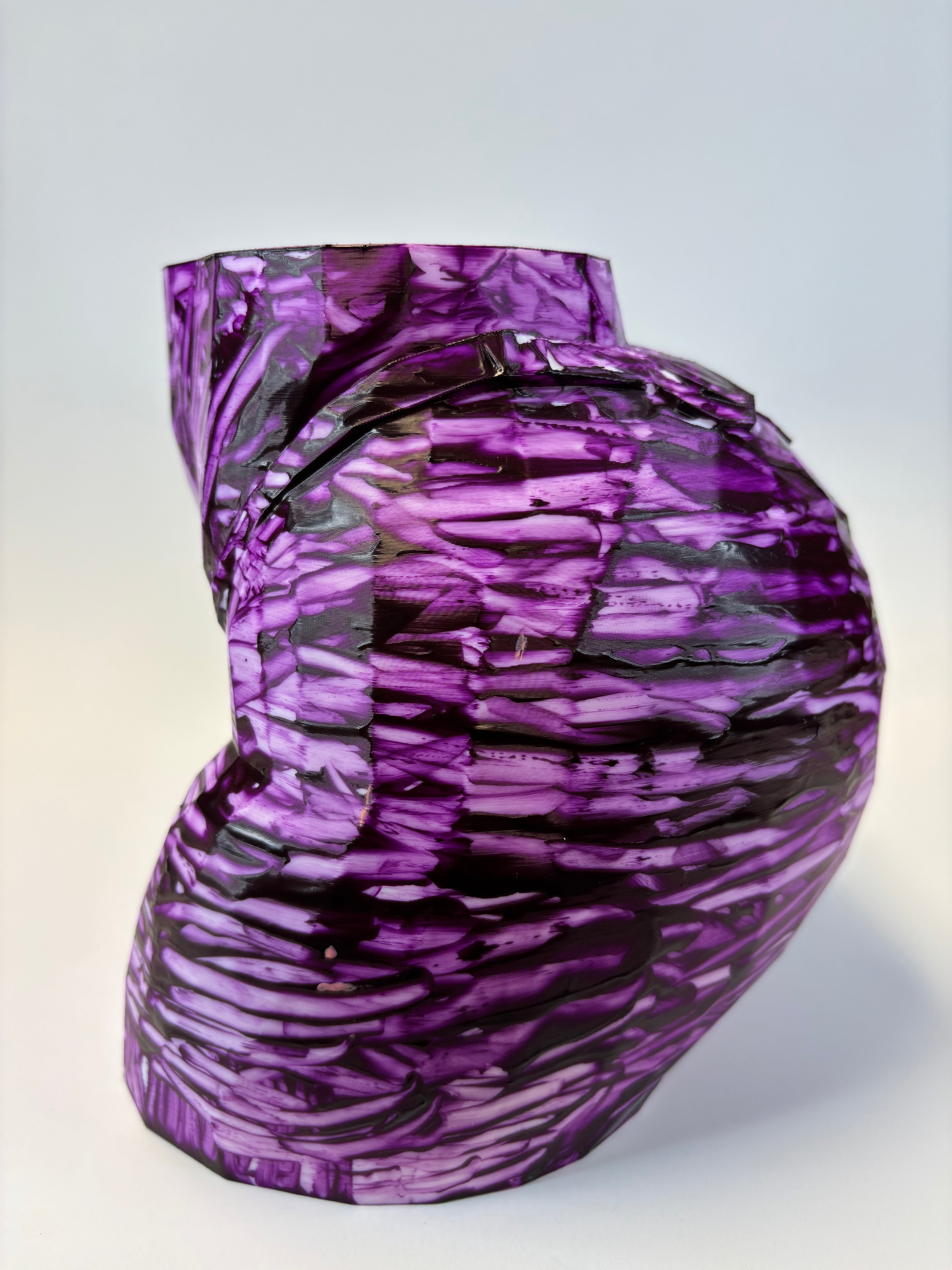 Purple and black patterned ass like vase.