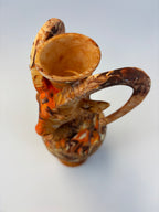 Decorative vase with intricate patterns on a white background