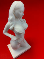 White statue of a woman on a red background