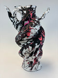 Abstract art piece with black, white, and pink colors on a gray background