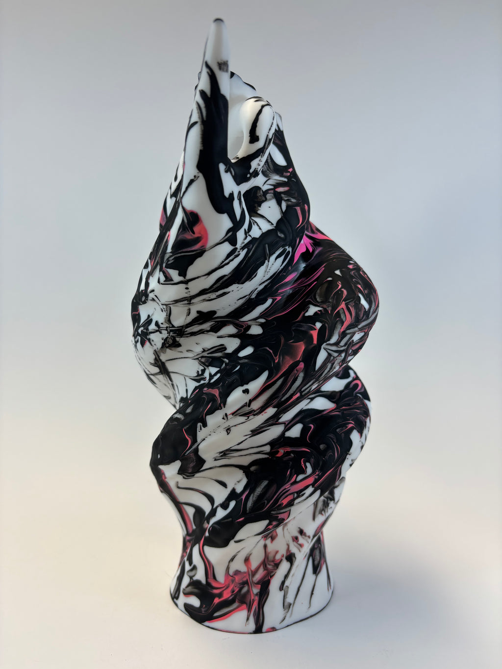 Black and white abstract art piece on a light gray background