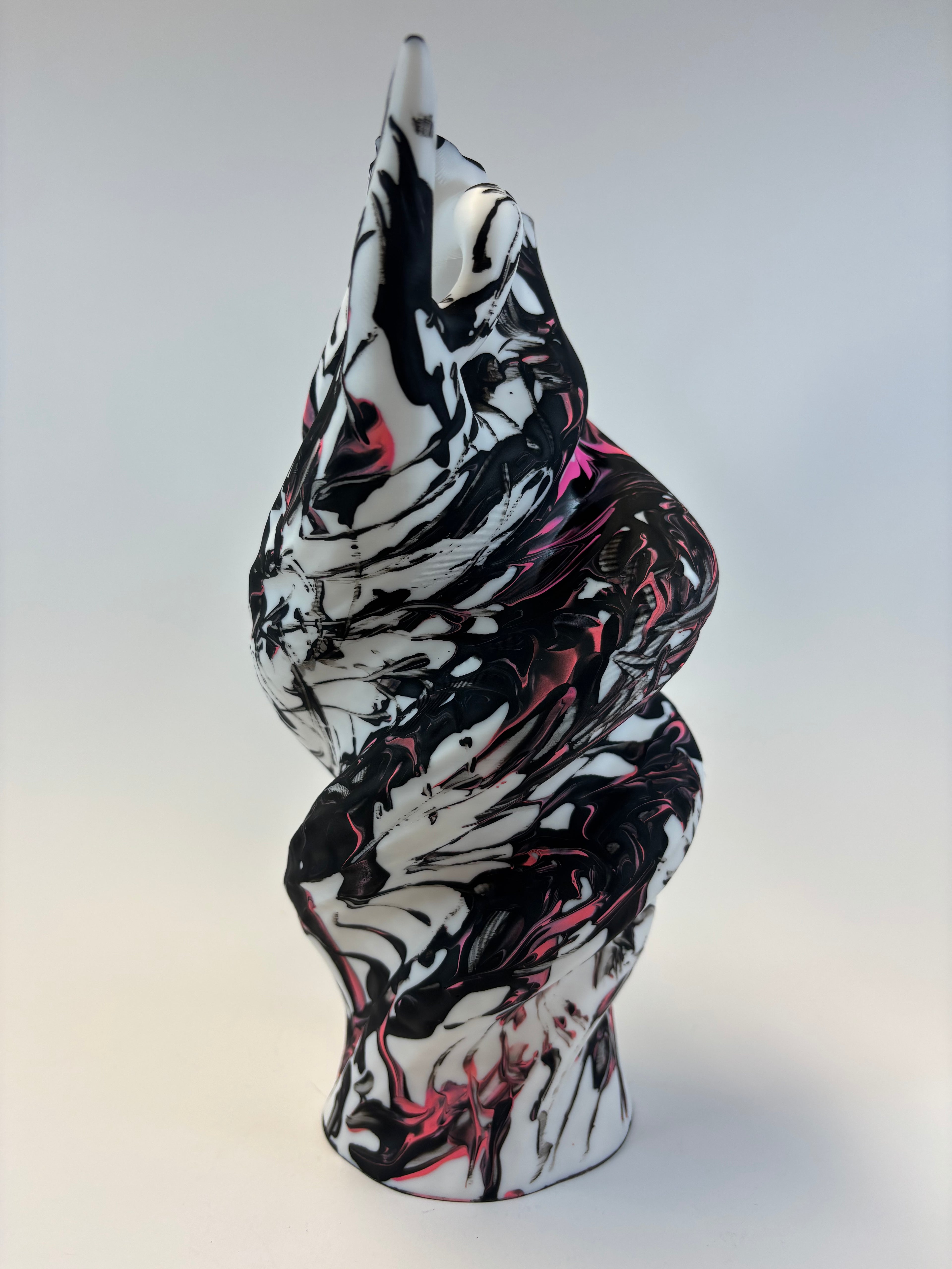 Black and white abstract art piece on a light gray background