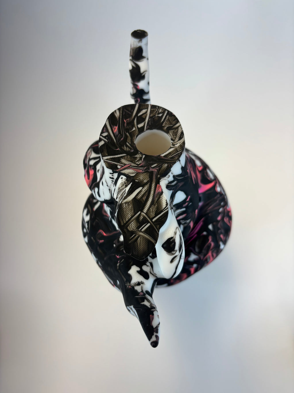 Decorative vase with abstract design on a light gray background