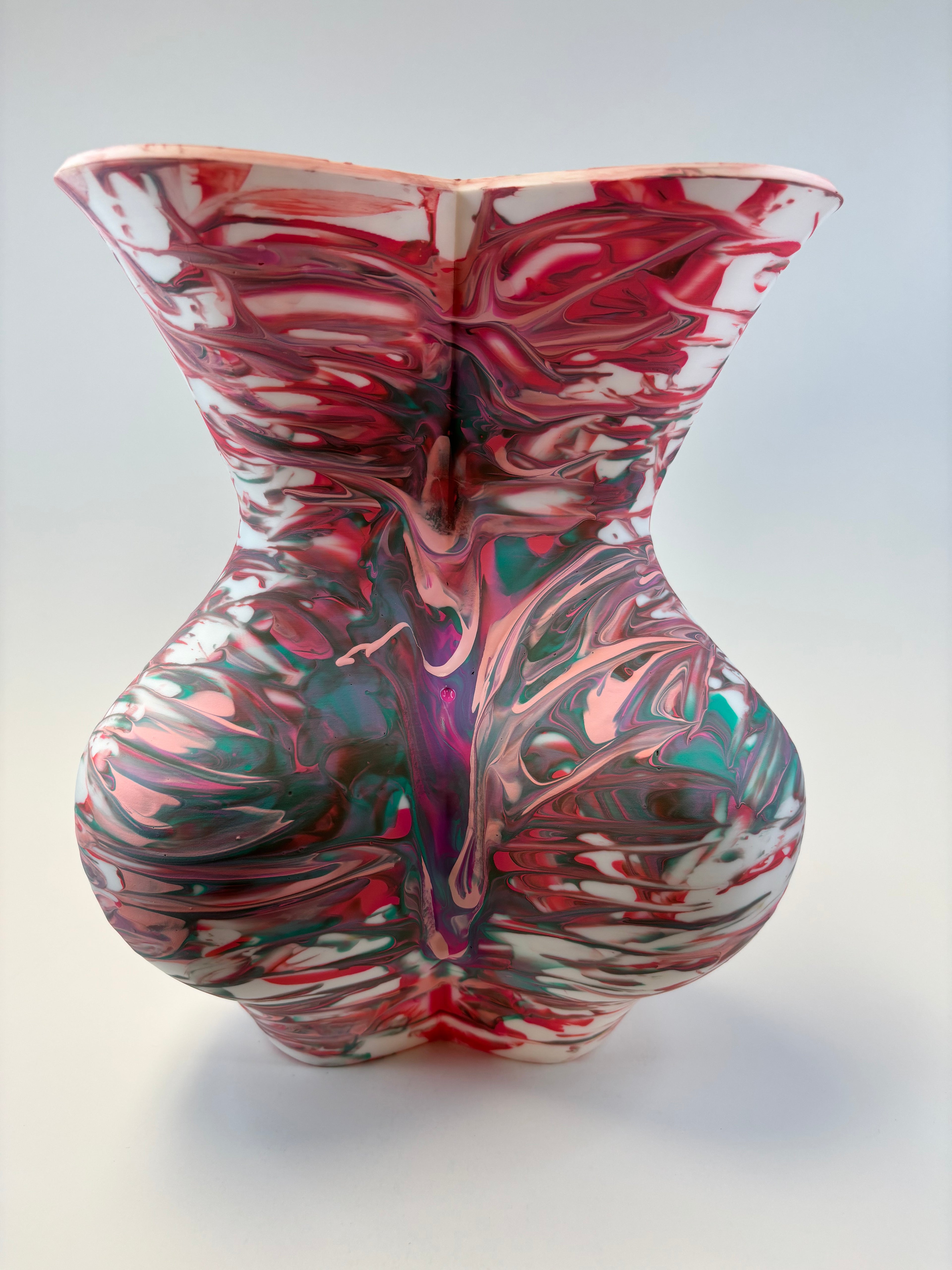 Marbled ceramic vase with multicolor design on a white background