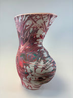 Marbled patterned object on a white background