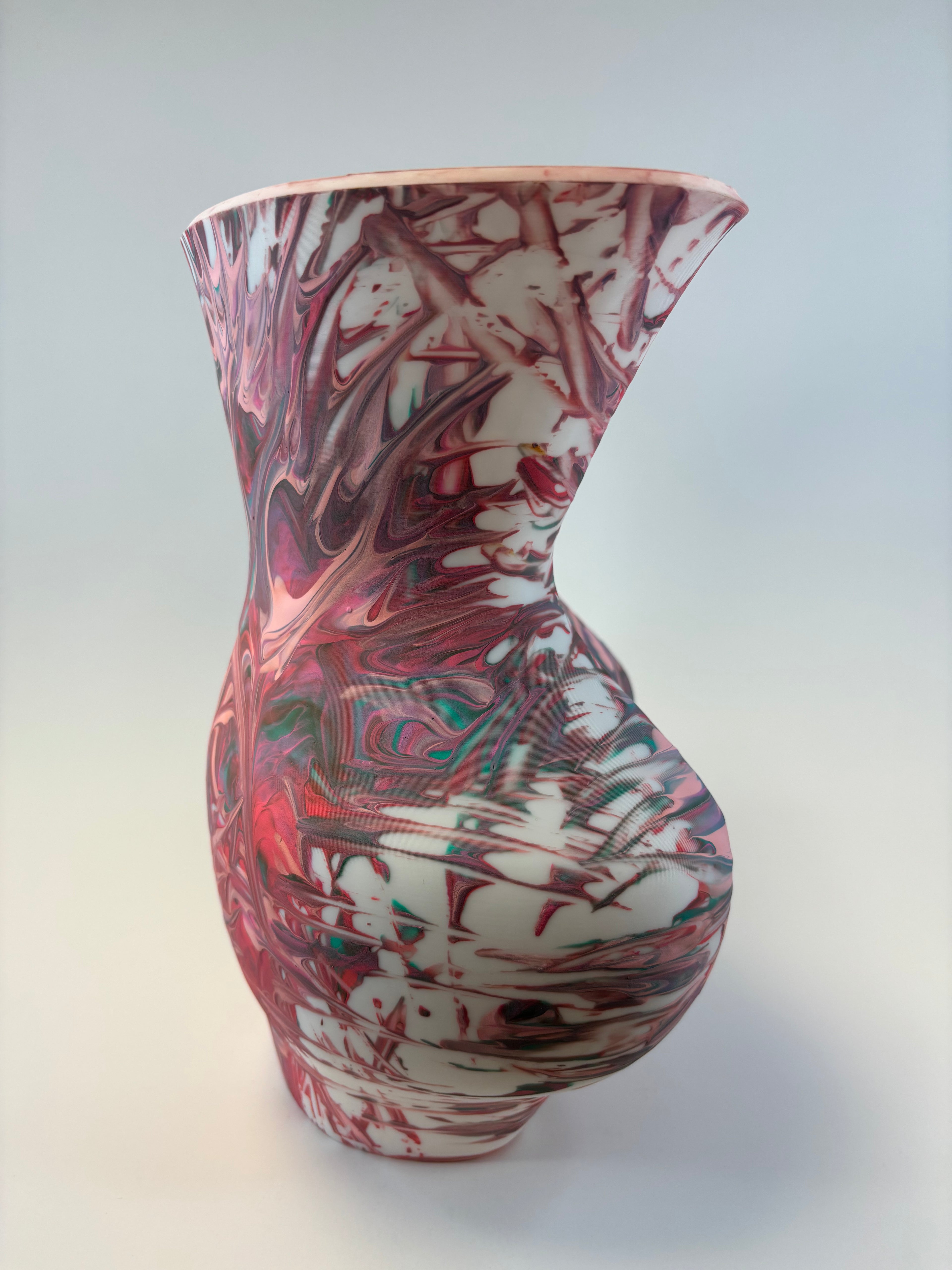 Marbled patterned object on a white background