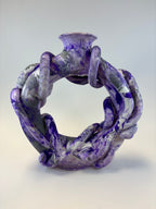 Purple and gray marbled ring vase on a light gray background