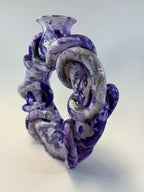 Purple and white vase on a light gray background