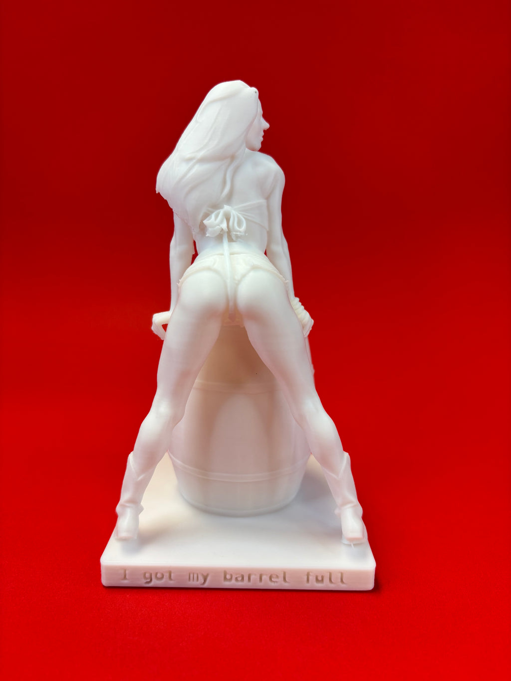 White statue of a woman on a red background
