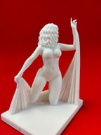 White sculpture of a figure on a red background