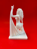 Statue of a woman with a drape on a red background