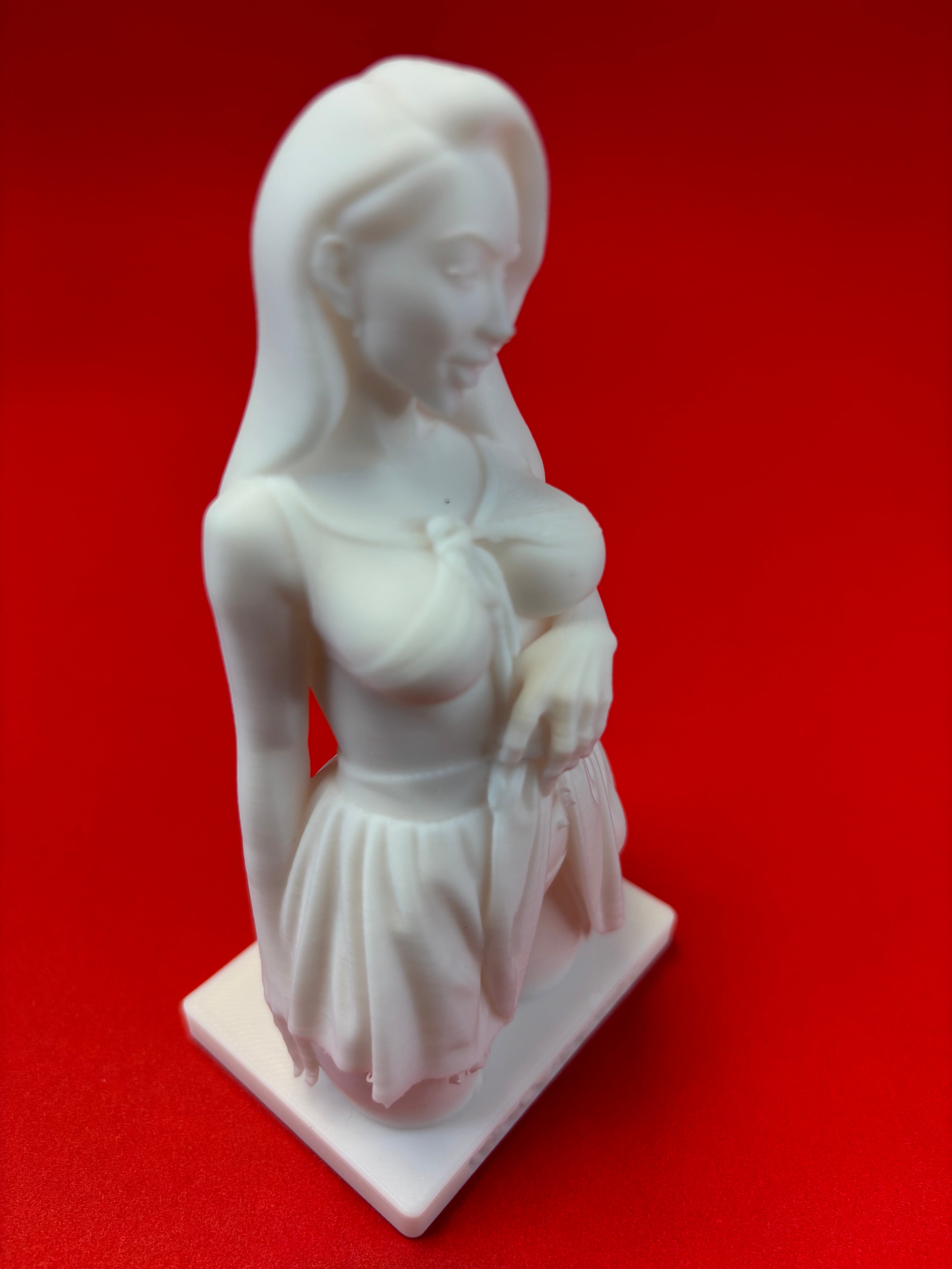 White statue of a woman on a red background