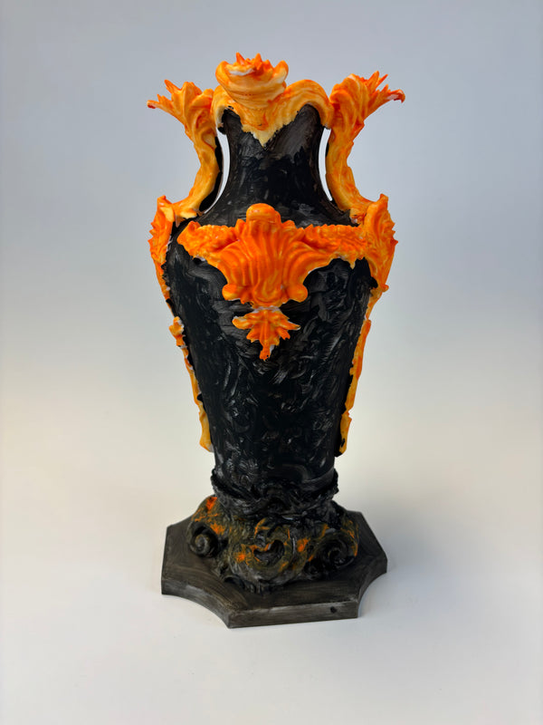 Decorative vase with black and orange flame-like design