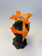 Decorative vase with black and orange flame-like design